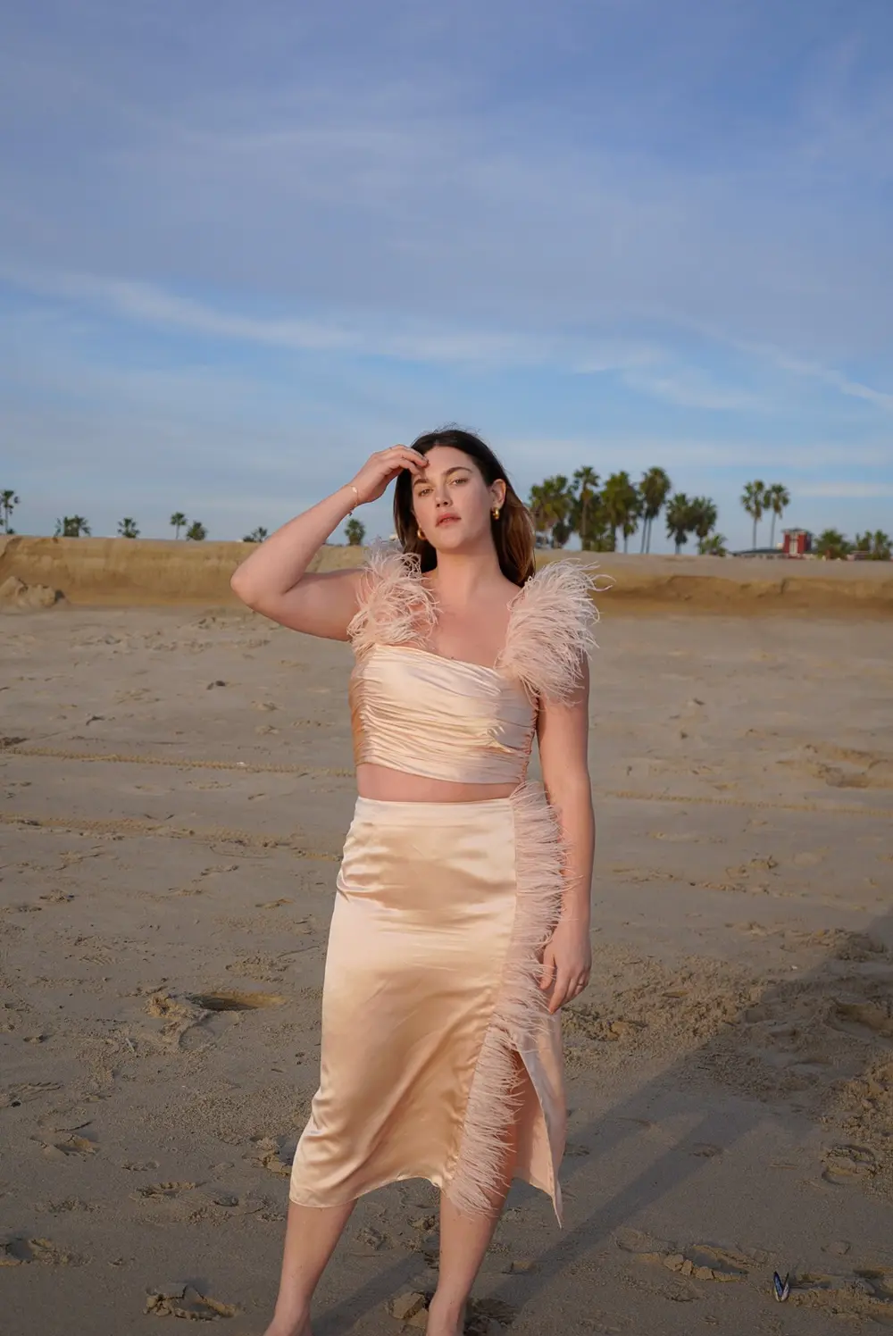 Ali Tate Cutler in a peach silk feathered set on Venice Beach